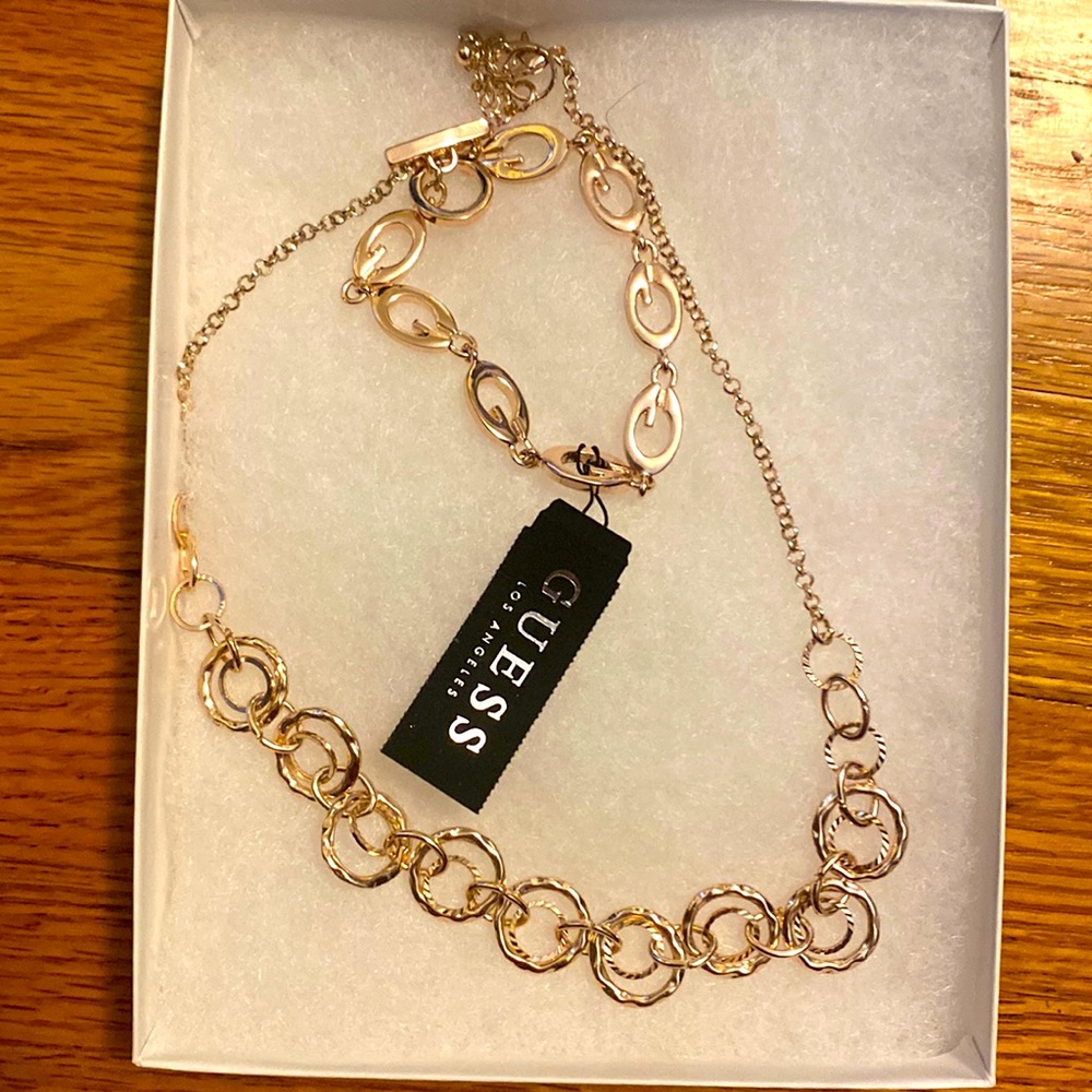 Rose gold Guess “G” link bracelet. Unbranded loop necklace included.